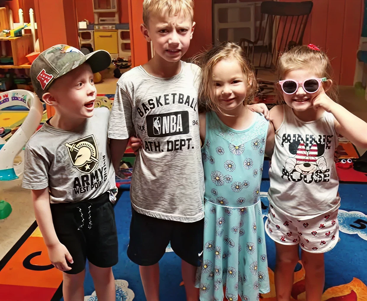 Children posing together in playroom